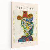 Abstract Picasso-inspired wall art on stretched canvas, featuring a mix of vibrant and muted colors.