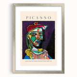 Textured abstract art print in silver frame, featuring neutral and blue tones on canvas, suitable for bedroom decor.