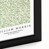 Close-up of a black framed canvas featuring a colorful, textured William Morris design, ideal for living room decor.