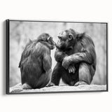 Framed wall art featuring a colorful chimpanzee design, showcasing vibrant hues of blue, yellow, and green against a sleek black frame, ideal for animal lovers.