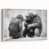 Framed wall art featuring a playful design of a monkey and an ape, showcasing vibrant colors against a clean white background, ideal for animal-themed decor.