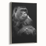Framed wall art featuring a vibrant design of a monkey and gorilla, displayed from the side with a sleek silver frame, ideal for modern home decor.