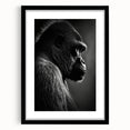 Framed wall art featuring a striking design of a monkey and ape gorilla in a modern black frame with a mat, perfect for contemporary home decor.