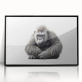 Framed wall art showcasing a striking design of a monkey and gorilla, featuring a black frame and acrylic finish, perfect for modern decor and animal lovers.