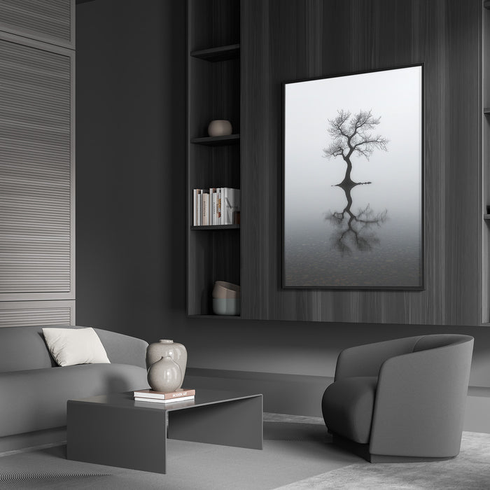 Black and white tree wall art in a dark-toned modern living room with minimalist furniture