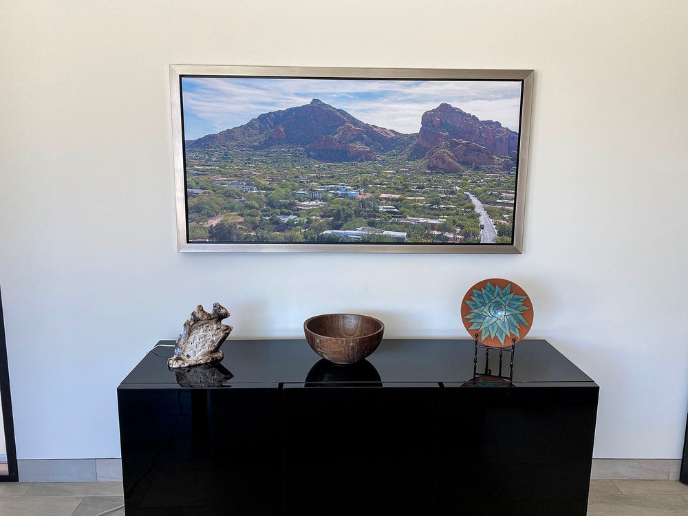 Landscape print above a console