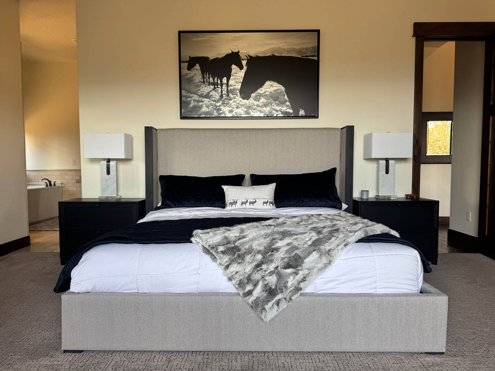 Black and white print above the bed
