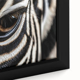 Close-up of a bird in textured black wall art with vibrant color accents on framed canvas, ideal for living room decor.