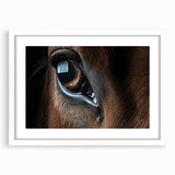 Abstract art print featuring vibrant blue and green peacock feathers on a white framed canvas.