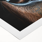 Art deco poster featuring a close-up of a bird in muted earth tones on rolled canvas.