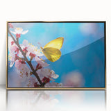 Large art print of a mid-century modernist bird design in muted gold tones on framed acrylic.