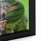 Close-up of a bird depicted in textured, colorful art on a black framed canvas, ideal for living room decor.