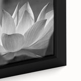 Close-up of a black framed canvas featuring vibrant, textured floral designs in multiple colors, ideal for living room decor.