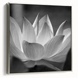 Framed canvas of a vintage-style landscape painting featuring colorful florals against a black background.