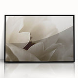 Large abstract wall art featuring floral designs in muted earth tones on a black acrylic frame.