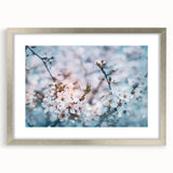 Textured art print of abstract florals in soft pastel colors, framed in silver, ideal for bedroom wall decor.