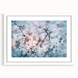 Abstract art print of floral designs in soft pastel shades on a white-framed canvas.