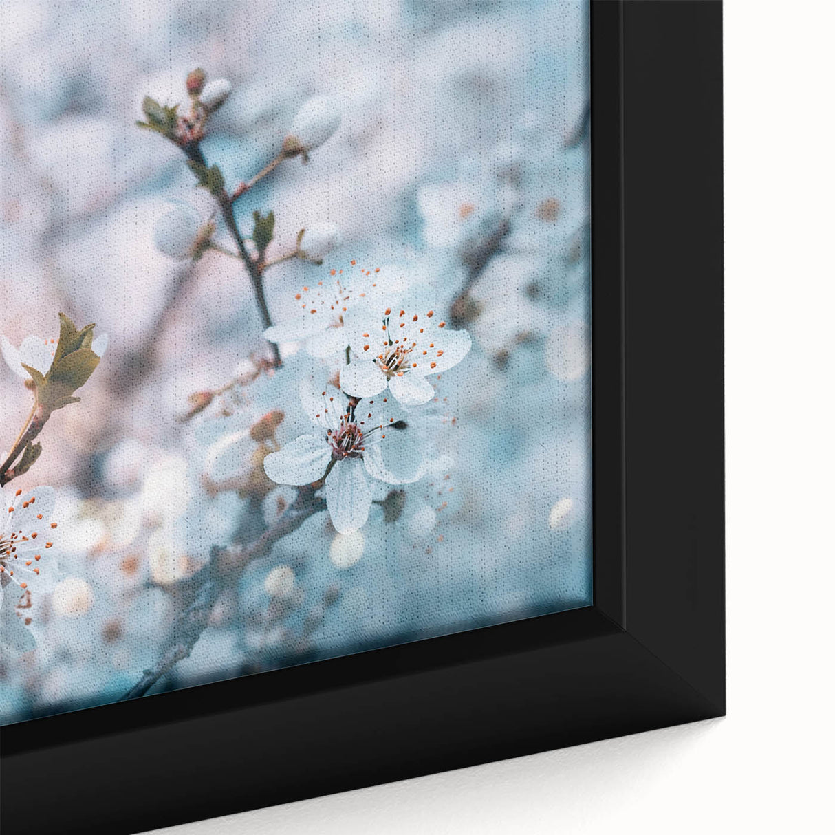 Close-up of textured black wall art featuring vibrant floral designs on a framed canvas, ideal for living room decor.