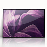 Large abstract wall art featuring vibrant floral designs in a black framed acrylic, ideal for modern living room decor.