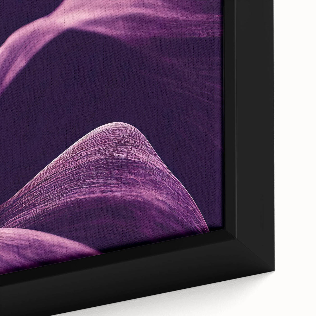 Close-up of textured black wall art featuring colorful florals on framed canvas, suitable for large living room spaces.