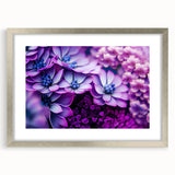 Textured art print of abstract florals in muted earth tones, framed in silver, ideal for bedroom decor.
