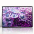 Large abstract wall art featuring floral designs in muted colors on a black acrylic frame.