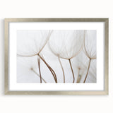 Textured art print of abstract florals in soft pastel shades on a silver-framed canvas, ideal for bedroom decor.
