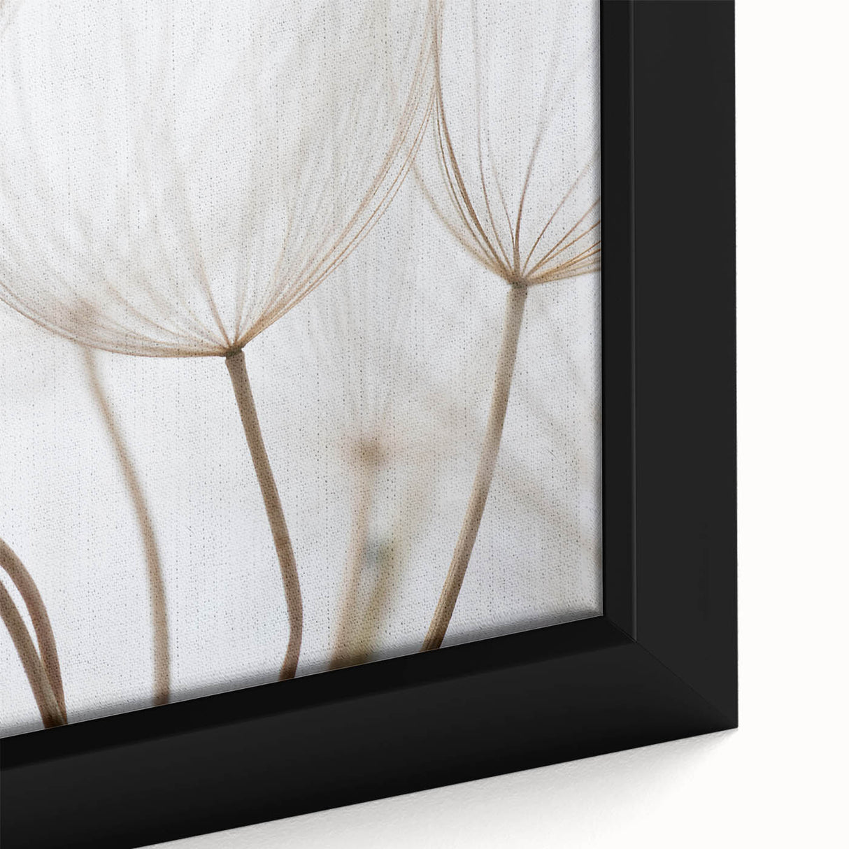 Close-up of a black framed canvas featuring a colorful, textured floral design, ideal for living room decor.