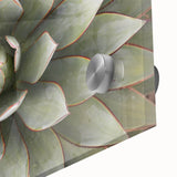 Large abstract floral design in vibrant orange and yellow tones on acrylic glass, suitable for dining room art.