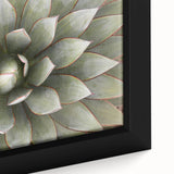 Close-up of a black textured canvas featuring vibrant, colorful floral designs, ideal for living room decor.