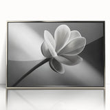 Mid-century modernist floral design in muted greens and blues on a silver-framed acrylic print.