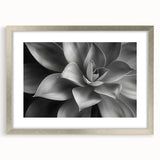 Textured art print featuring abstract floral designs in soft pastel shades, framed in silver, ideal for bedroom decor.