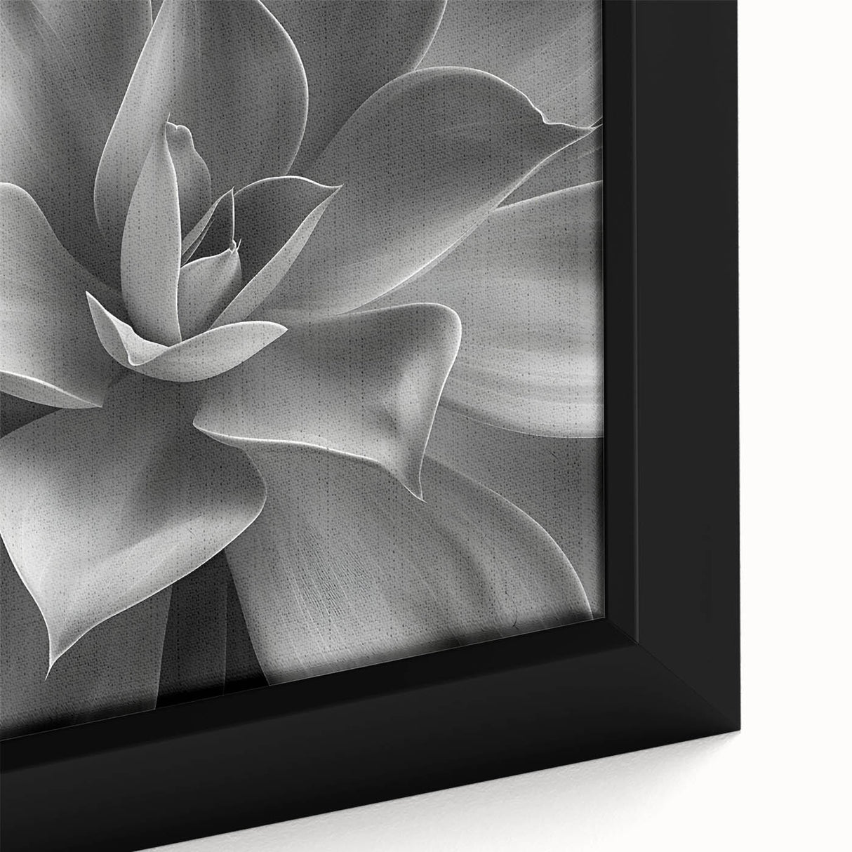 Close-up of a black wall art featuring colorful, textured flowers on a large framed canvas, ideal for living room decor.