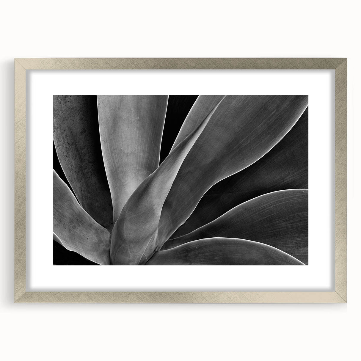 Textured art print of abstract florals in soft pink and white, framed in silver, ideal for bedroom wall decor.