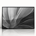 Large abstract wall art featuring vibrant floral patterns in a mid-century modernist style, framed in black acrylic.