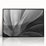 Large abstract wall art featuring vibrant floral patterns in a mid-century modernist style, framed in black acrylic.