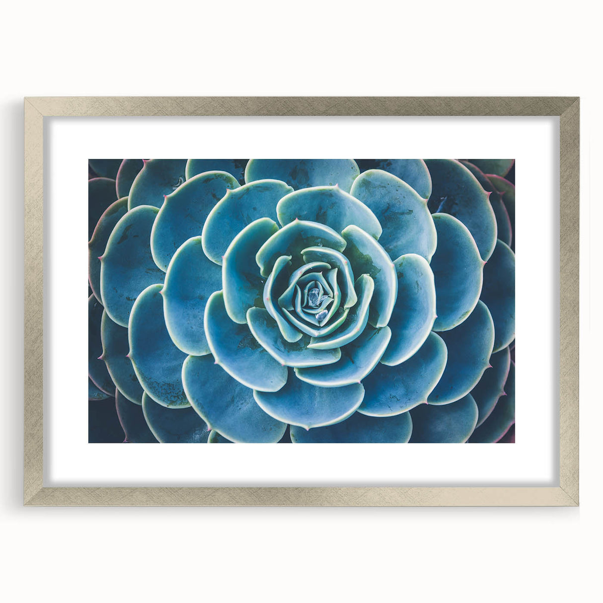 Textured art print of abstract florals in soft pastel shades, framed in silver, ideal for bedroom wall decor.