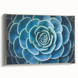 Framed canvas featuring a vintage landscape painting with colorful florals against a black background.