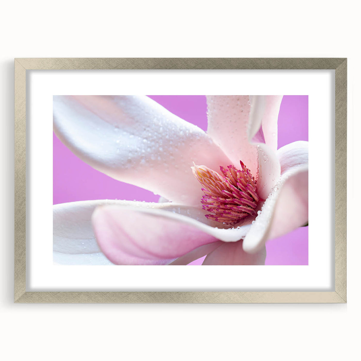Textured art depicting abstract floral designs in soft pastel shades on a framed silver mat, ideal for bedroom ambiance.