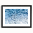 Extra large abstract art print featuring a close-up of frost in vibrant blues and whites, framed in black.