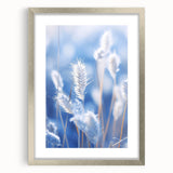Abstract art print of frost patterns in muted gray and silver tones on a framed poster.