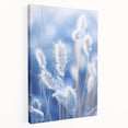 Close-up image of frost patterns on ice in muted blue and white tones, printed on stretched canvas.