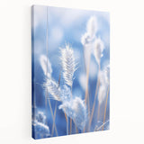 Close-up image of frost patterns on ice in muted blue and white tones, printed on stretched canvas.