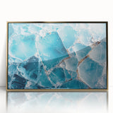 Mid-century modernist art depicting a frost design in muted blue tones on a gold-framed acrylic.