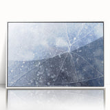 Framed acrylic print featuring a close-up of frost patterns in muted white and gray, ideal for modern nursery wall art.