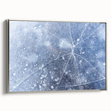 Framed canvas depicting a close-up of frost patterns in muted silver and gray tones, ideal for living room decor.