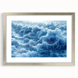 Abstract art print featuring a close-up frost design in muted blue tones on a silver-framed mat.