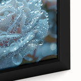 Close-up of black wall art depicting a frost design in colorful, textured strokes on a framed canvas.