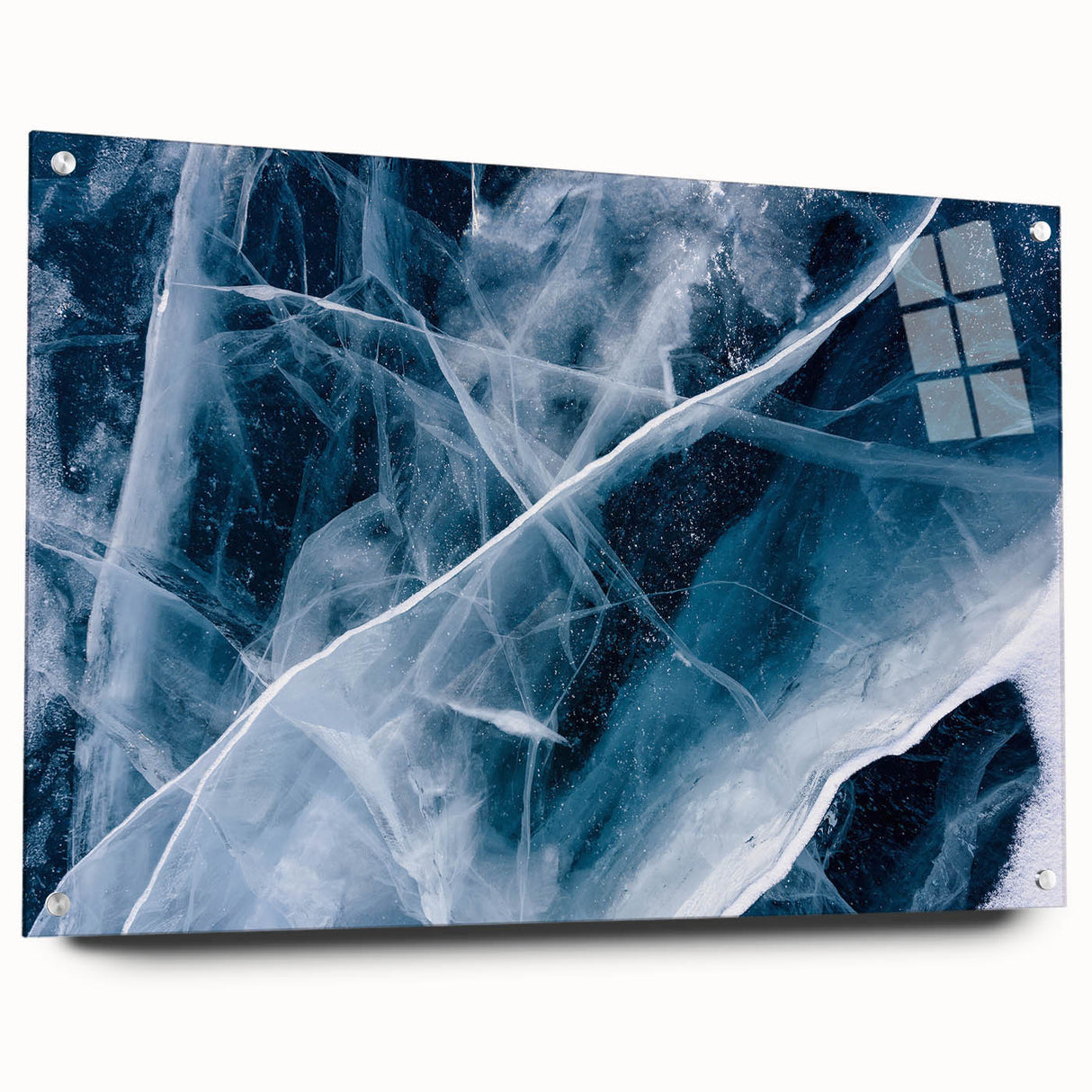 Frost pattern close-up on large acrylic glass, featuring cool blue and white tones.
