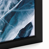 Close-up of black wall art featuring a frost design with textured colorful art on a framed canvas.